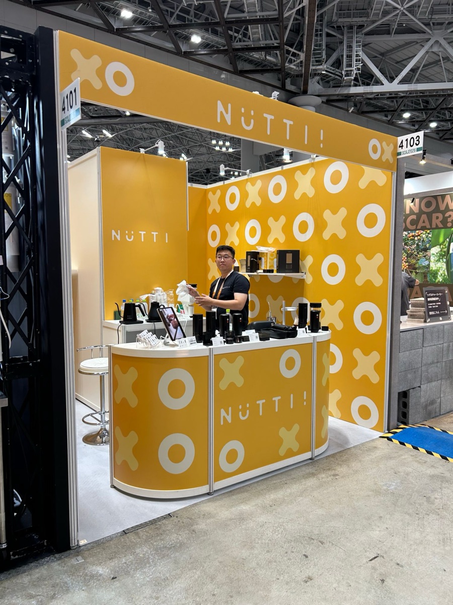 The yellow Nuttii booth, number 4103, at SCAJ 2026 in Tokyo Big Sight